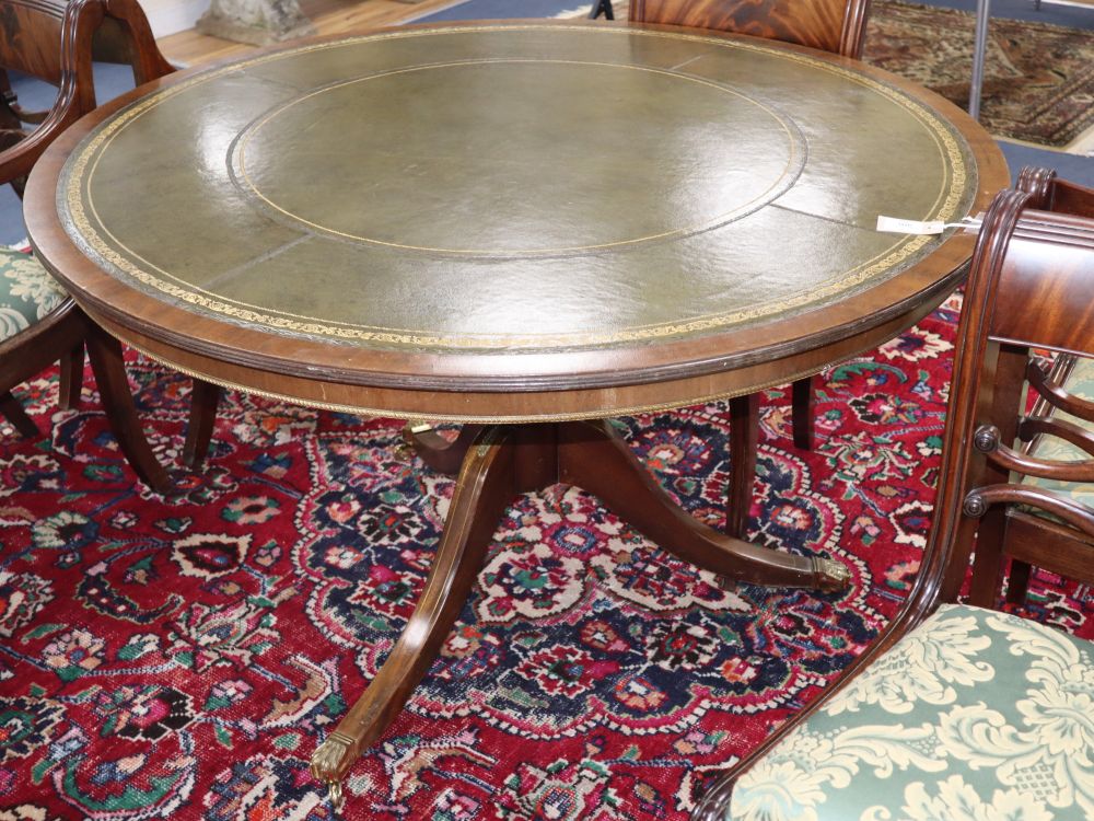 A reproduction George III style circular mahogany leather topped library table, 120cm diameter, H.74cm